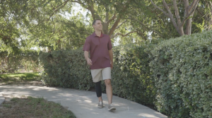 Steve walks confidently while wearing his Neural Sleeve